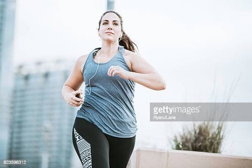 Wellness, A young adult woman goes for a morning run